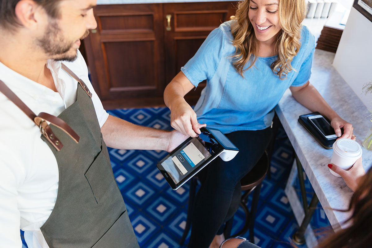 Woman paying with credit card